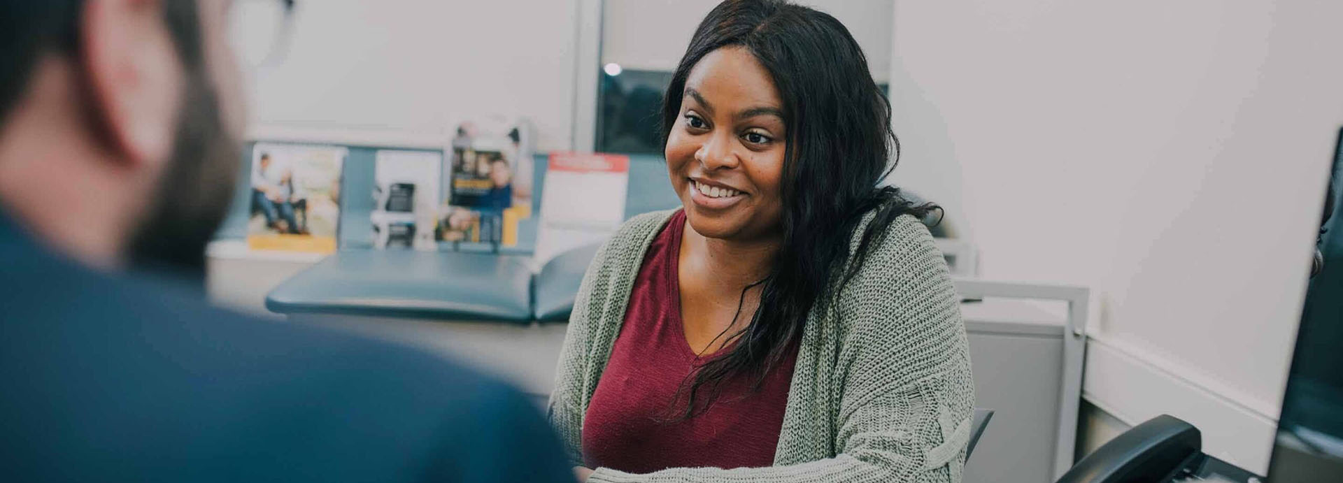 A woman listening at The Counseling Center